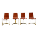 Set of four leather and brass Italian dining chairs