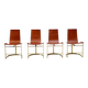 Set of four leather and brass Italian dining chairs