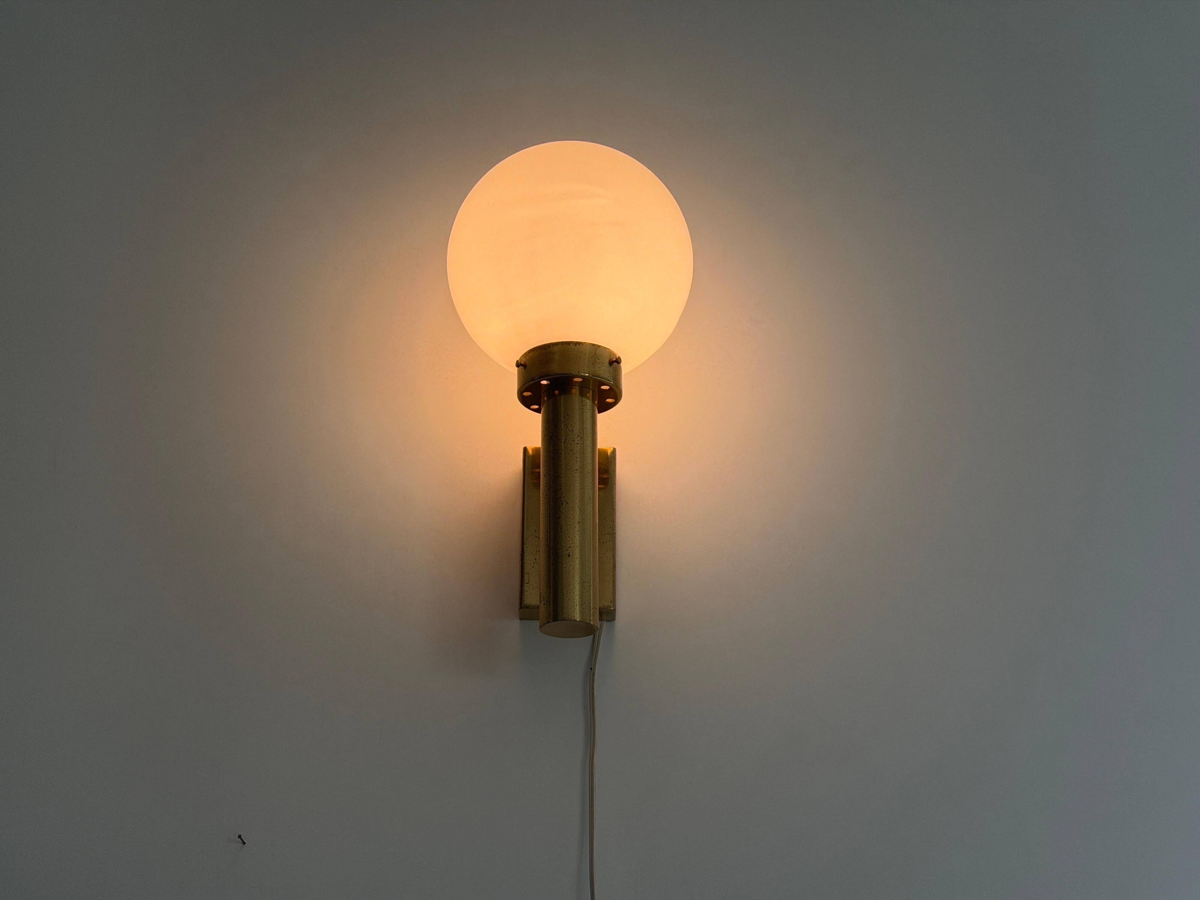 Large minimalist cinema wall light in opal glass and heavy brass, 1960s, Germany