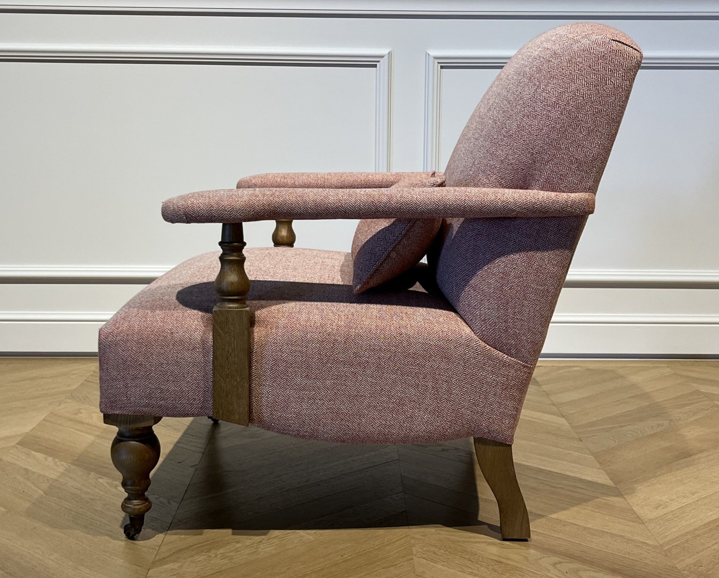 Wooden and red chevron fabric armchair with casters