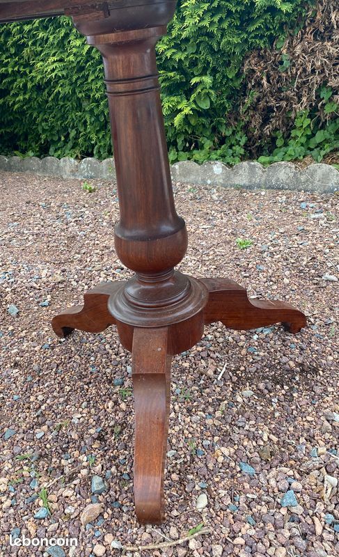 Old and large round winegrower's table made of wood.