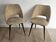Pair of vintage barrel chairs in boucle fabric with brass splayed legs.