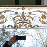 Glass mirror with a decoration engraved with golden foliage 1960