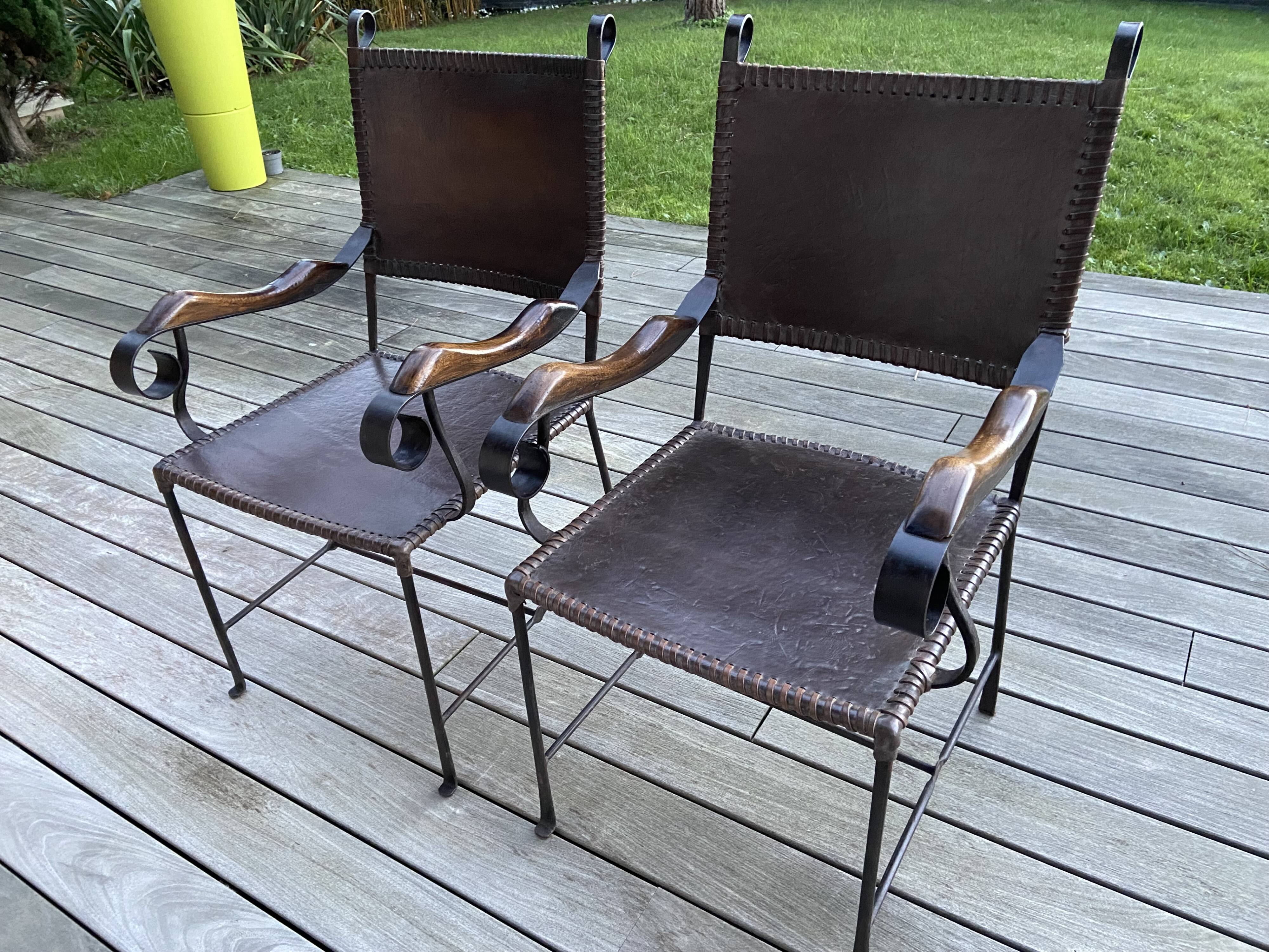 Pair of wrought iron armchairs