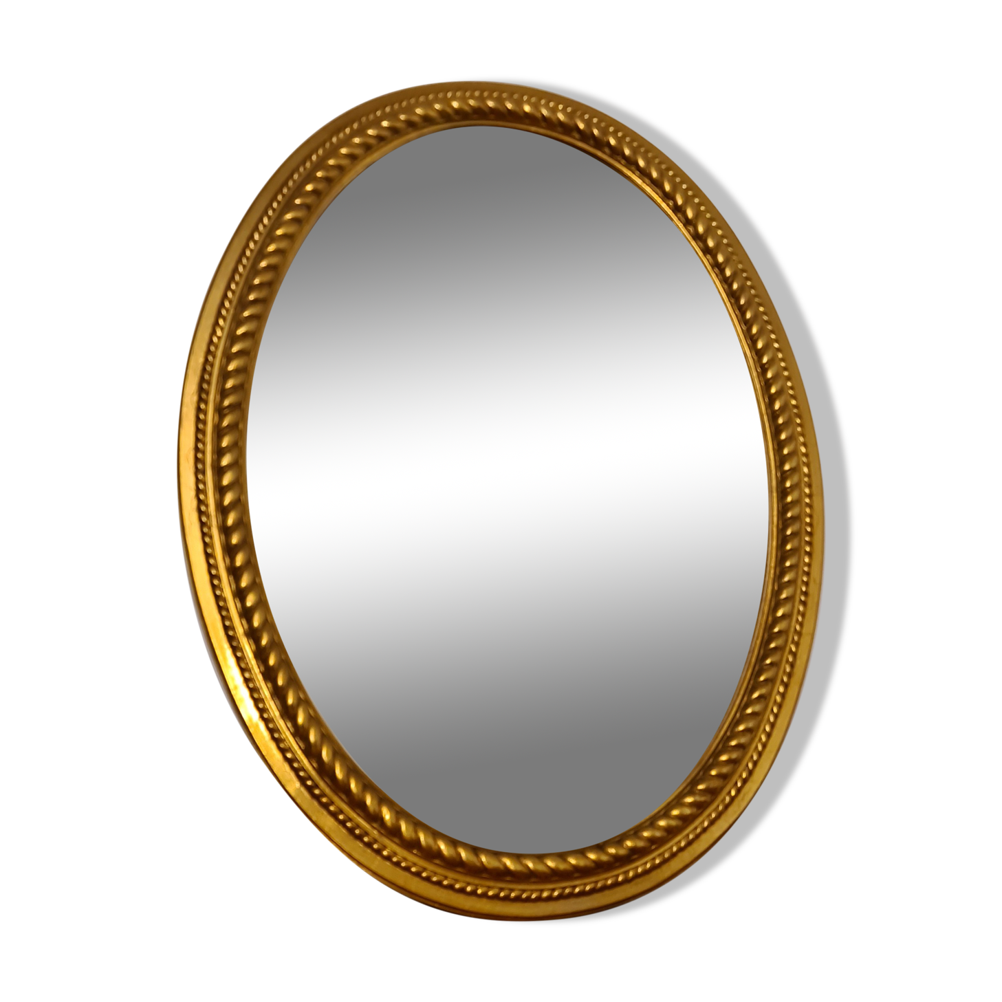 Beveled oval mirror in gilded wood 78×58cm