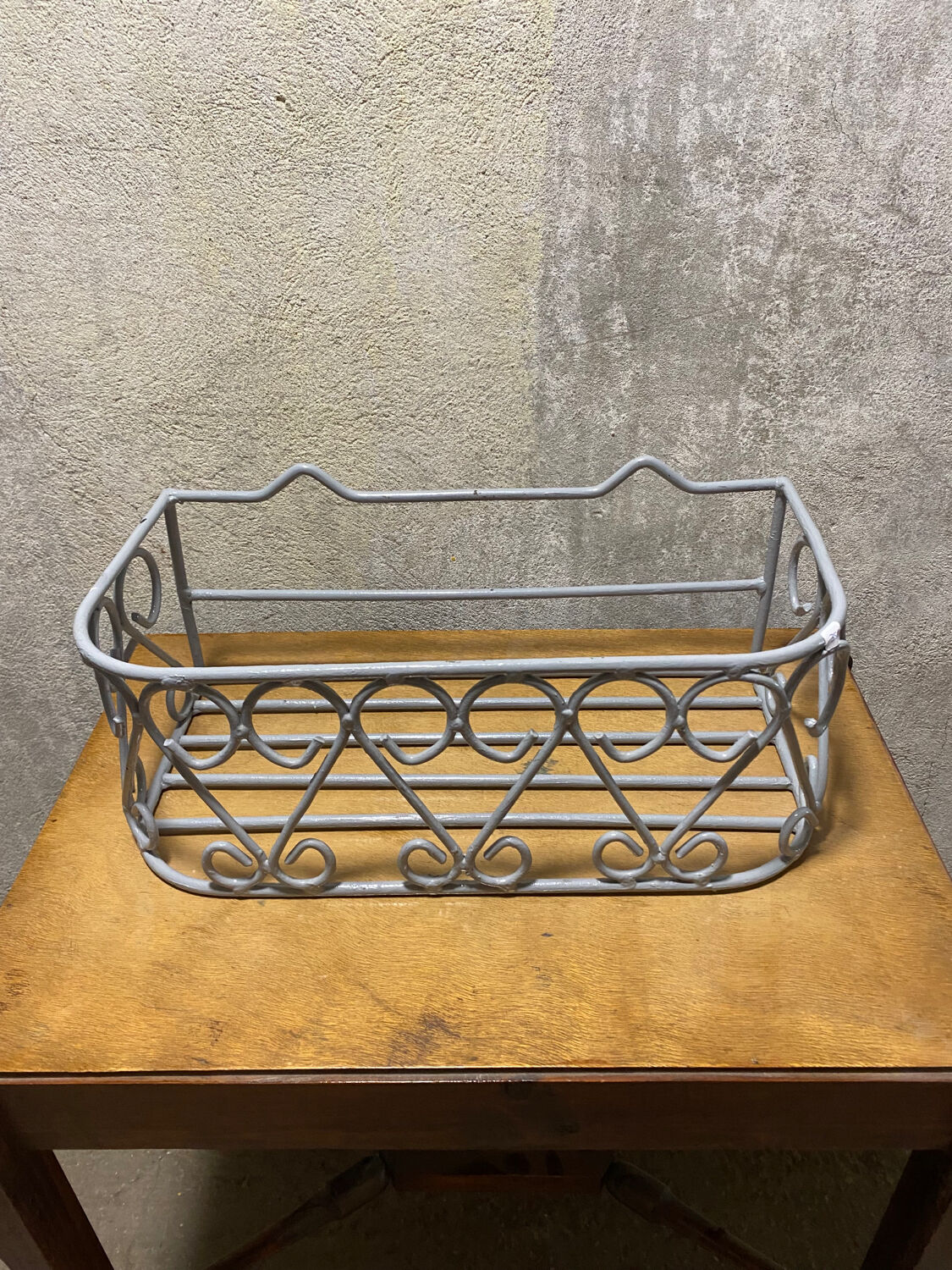 Gray wrought iron shelf