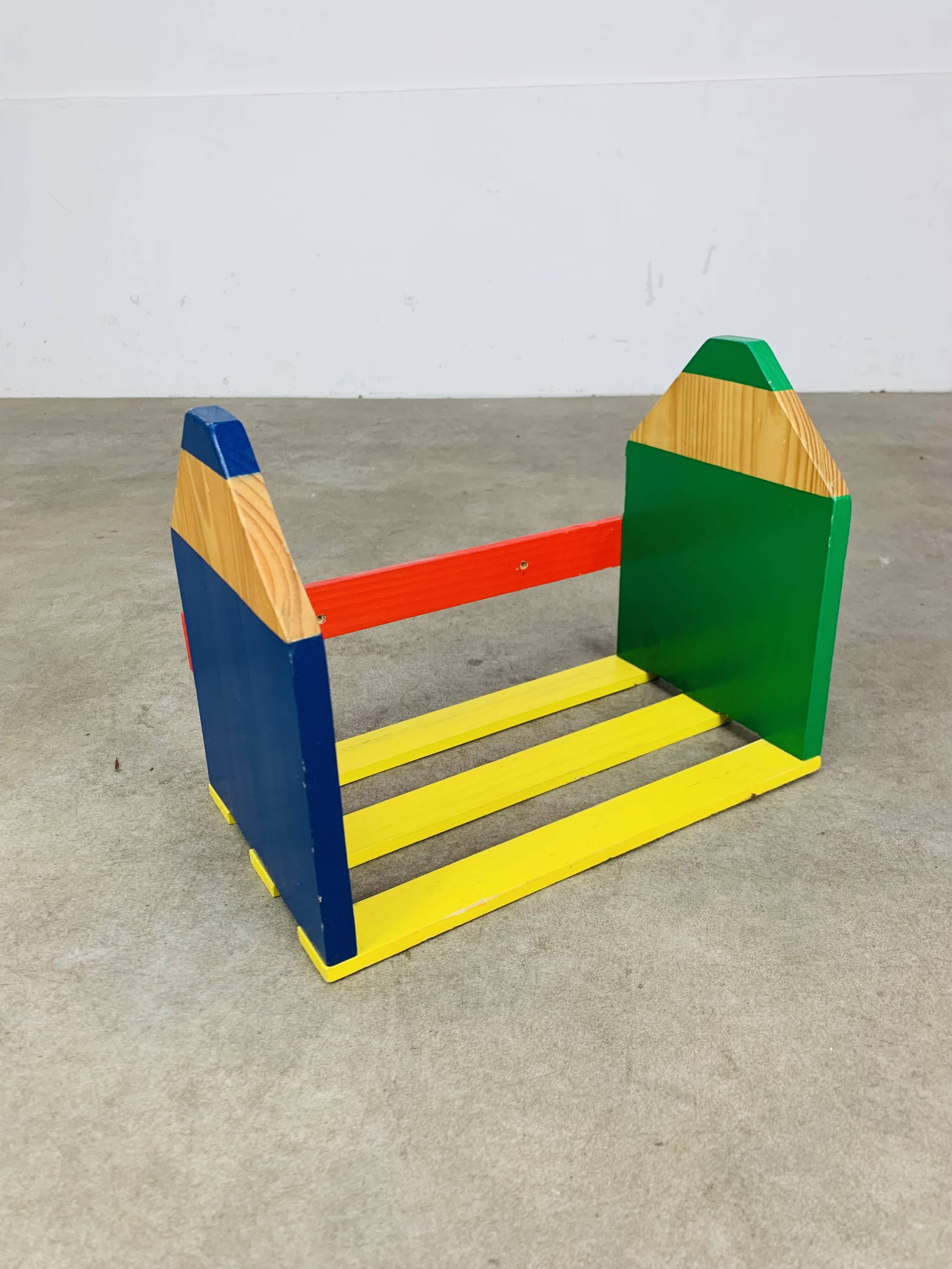 Wall-mounted pencil shelf for children, Pierre Sala style.