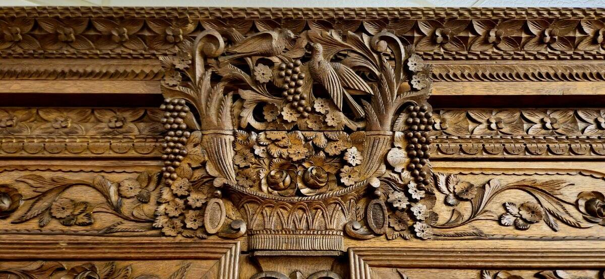 Norman Wedding Armoire in solid oak, richly carved, Louis period.