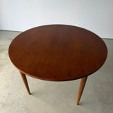 Scandinavian design extendable round table in teak, Danish manufacture.
