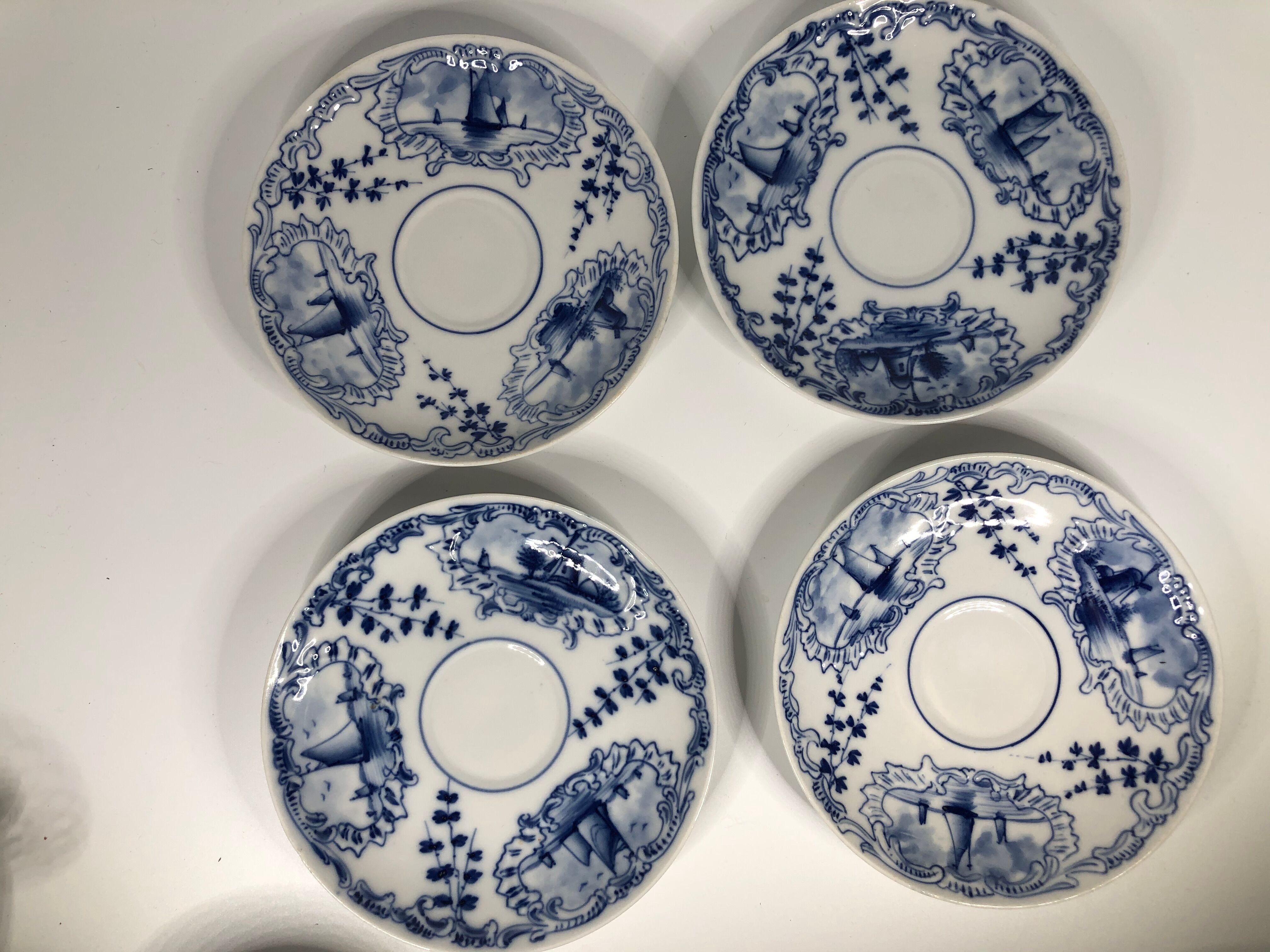 4 old cups and under Rauenstein Delft cups