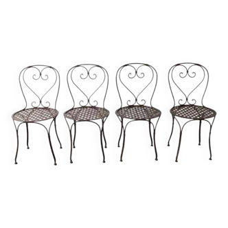 Set of 4 wrought iron chairs.