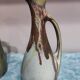 Two enameled stoneware pitchers