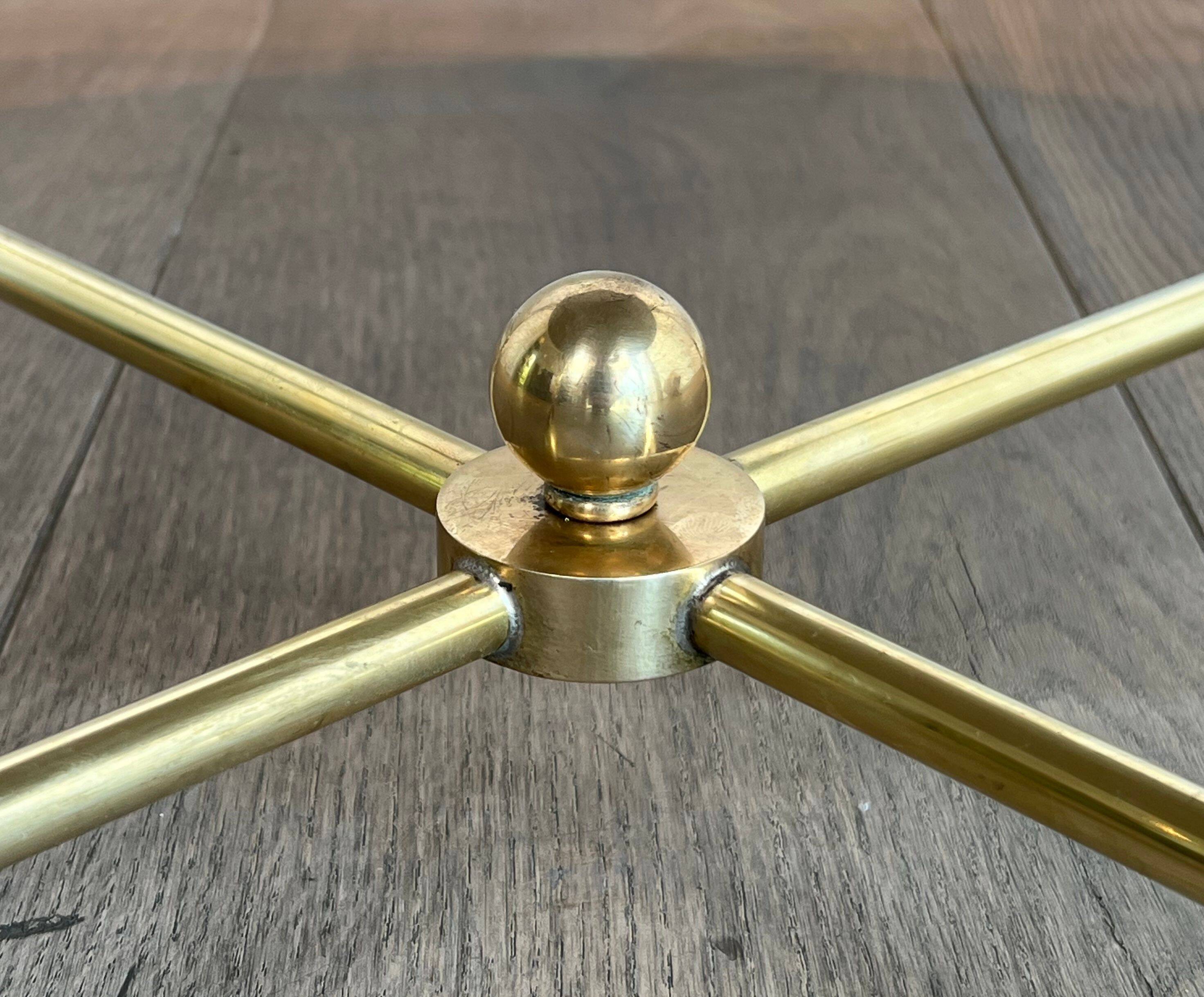 Brass coffee table with a white marble top.