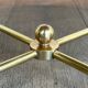 Brass coffee table with a white marble top.