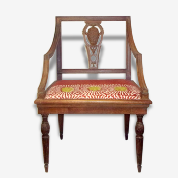 A Chair from the beginning of the 20th century in natural wood.