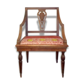 A Chair from the beginning of the 20th century in natural wood.
