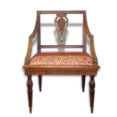A Chair from the beginning of the 20th century in natural wood.