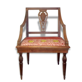 A Chair from the beginning of the 20th century in natural wood.