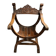 Fauteuil dit Dagobert en bois sculpté vers 1900