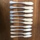 10 mismatched fish knives, silver metal