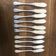10 mismatched fish knives, silver metal