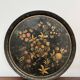 Round plateau, 19th century, painted black with fruit and grape decoration (49 cm)