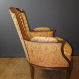 Pair of Louis XVI Bergères in walnut, late 18th century.