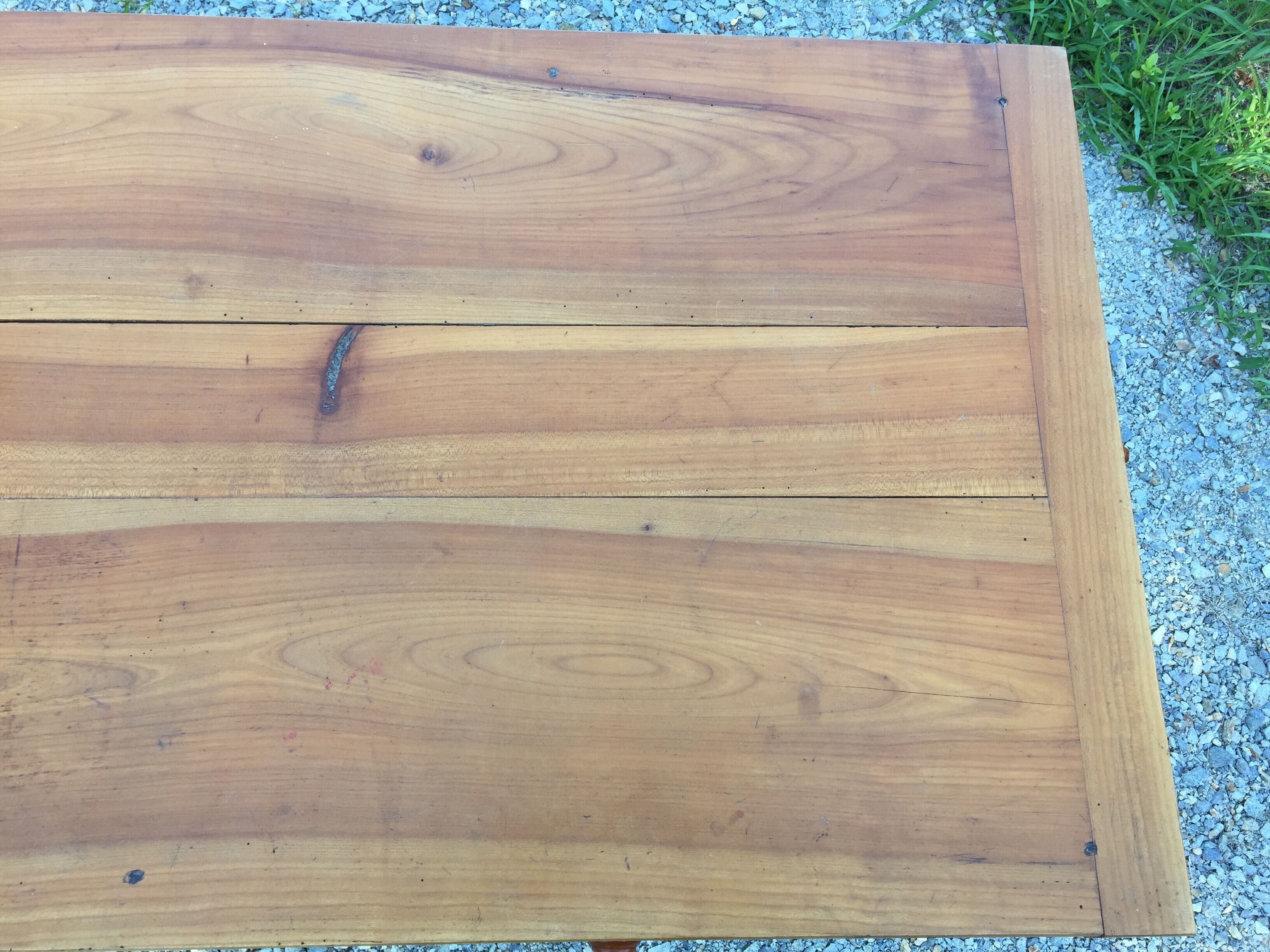 Old farmhouse table louis Philippe style in solid cherry with turned feet.