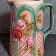 Antique slip pitcher with blooming roses