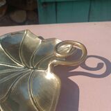 Gilded brass leaf pocket emptier
