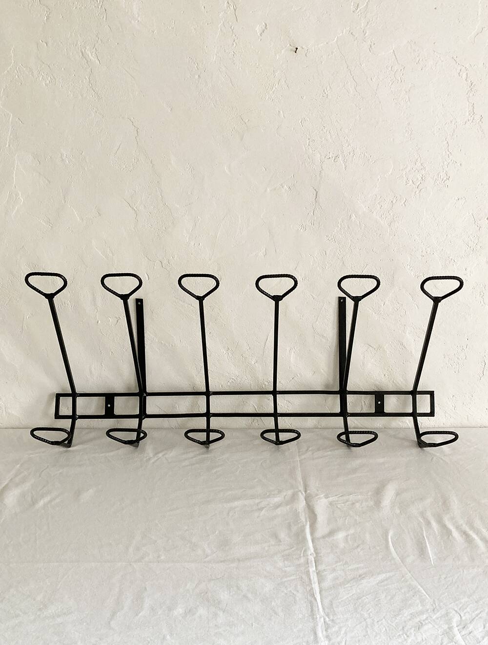 Wall-mounted coat rack with 12 hooks in handcrafted wrought iron