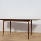 Extendable teak dining table in Mid-Century style from McIntosh, UK.
