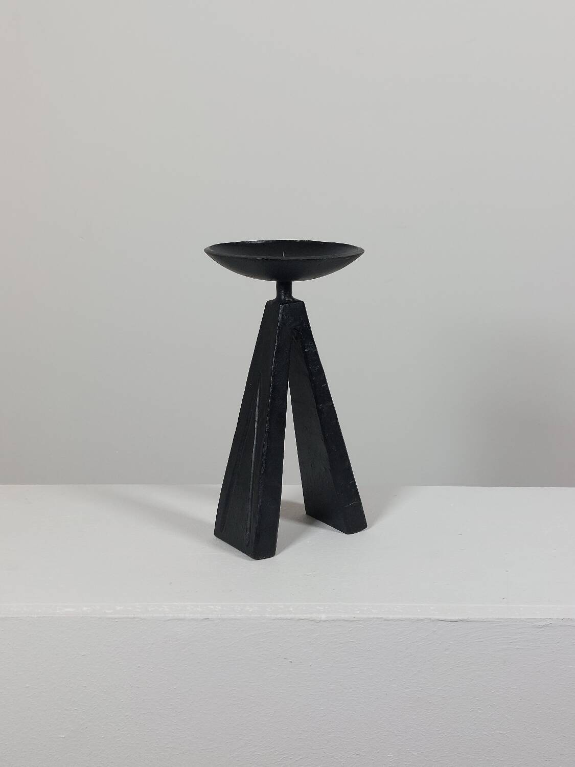 Vintage candle holder made of hand-forged metal, in a brutalist style.