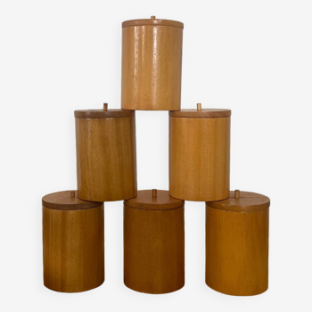 6 wooden spice jars.