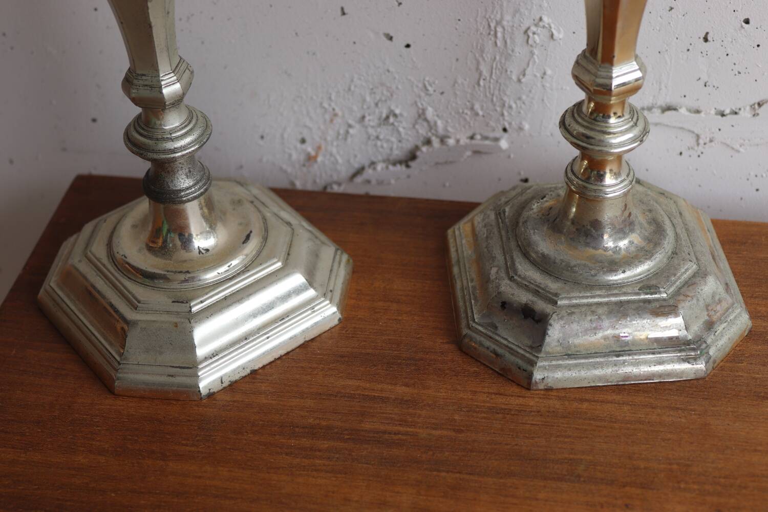 Pair of antique silver-plated metal candlesticks