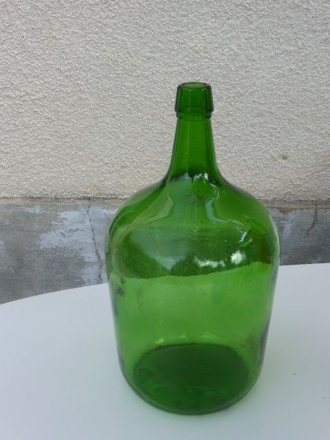 Dark green glass demijohn, vintage