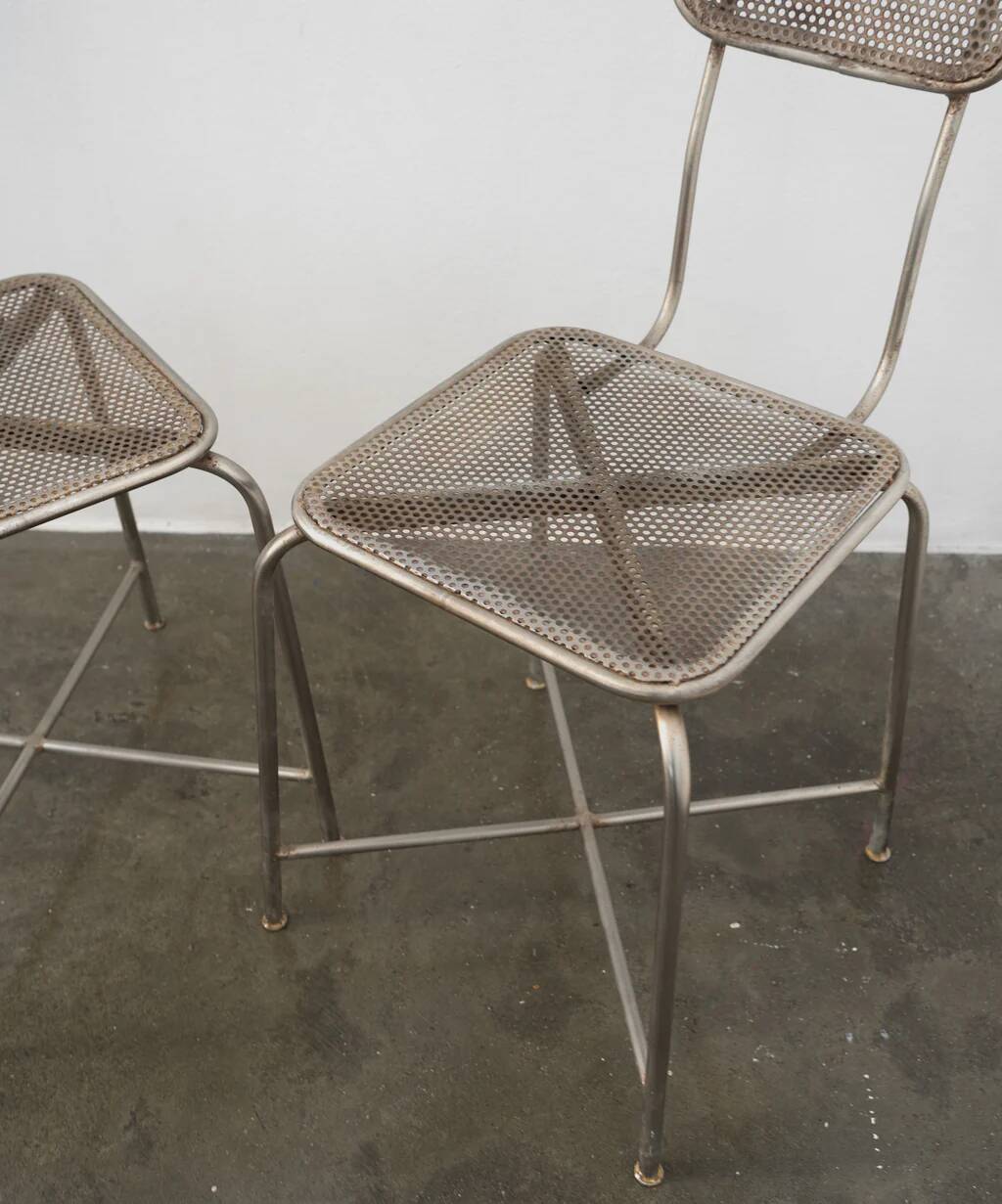 Vintage perforated metal chairs