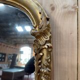 Napoleon III mirror in wood and gilded stucco with gold leaf.