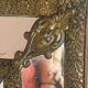 Mirror with brass repoussé frame