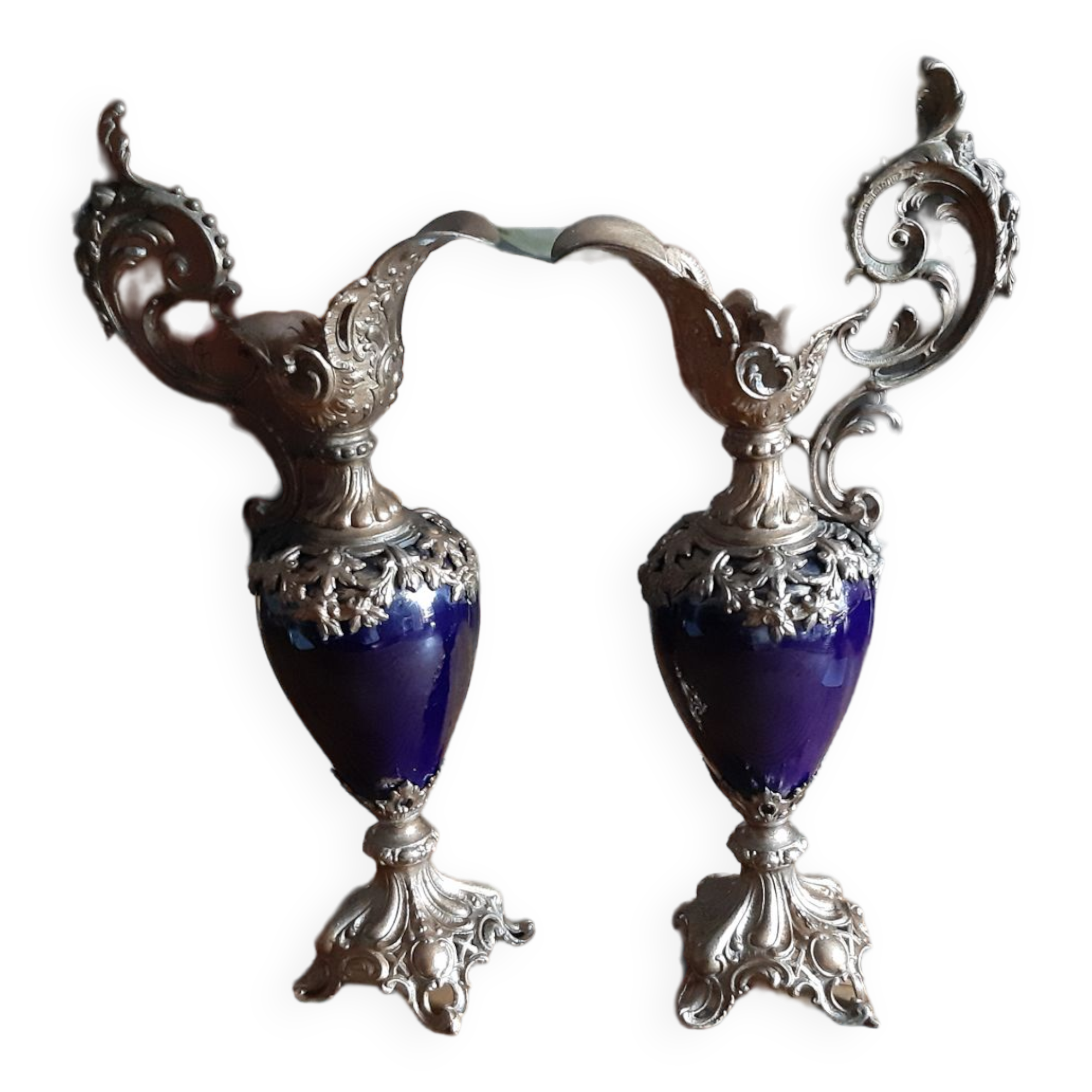 Pair of golden regulated ewers and blue glass