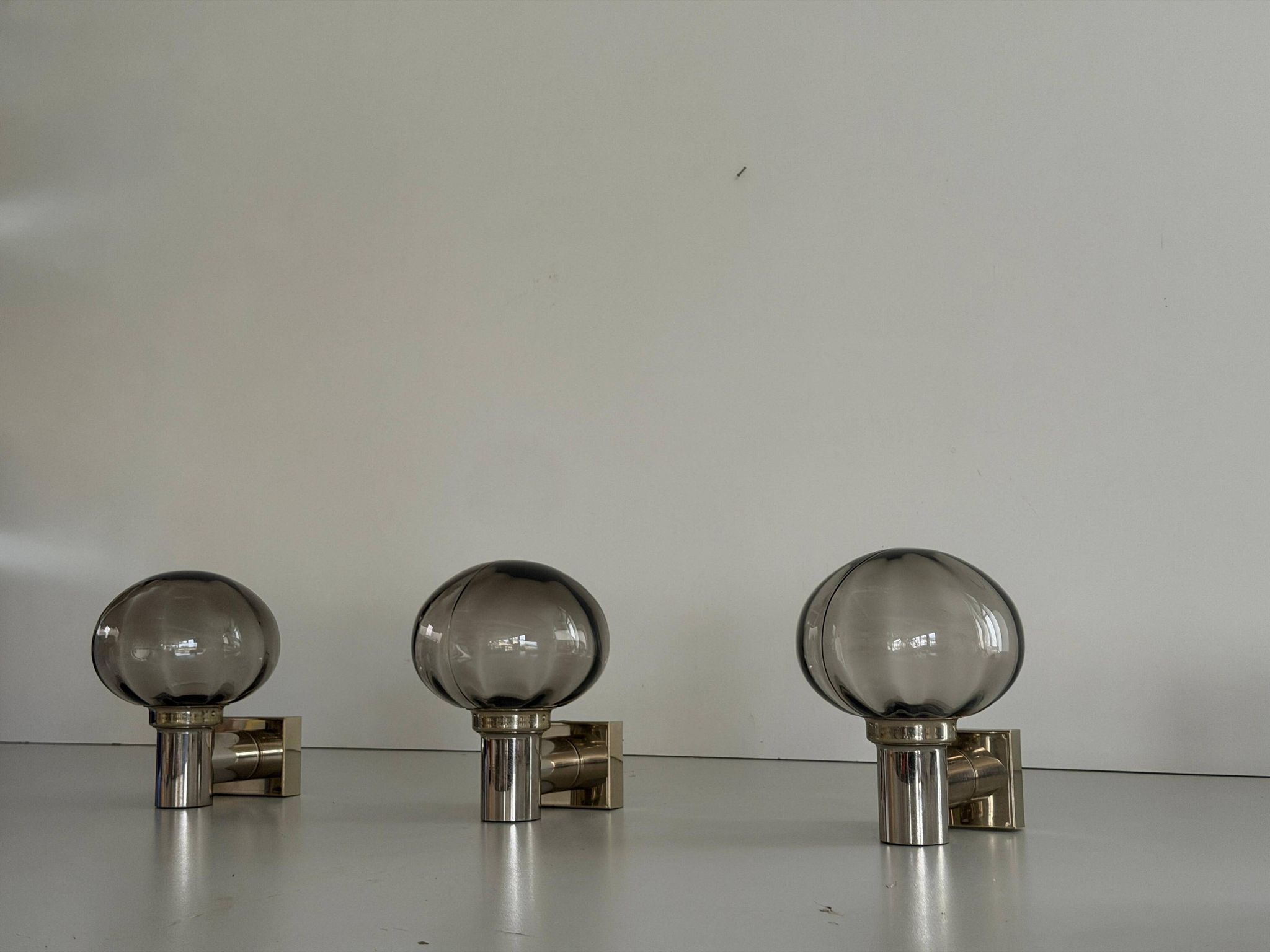 Set of 3 grey glass and chrome wall lights from the mid-century by N Leuchten, 1960s, Germany.