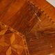 Antique round walnut table with a baluster central leg, Italy, 19th century.