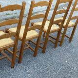 4 straw and solid wood chairs with high backs