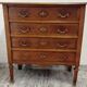 Antique marquetry commode in the Louis XVI style.