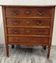 Antique marquetry commode in the Louis XVI style.