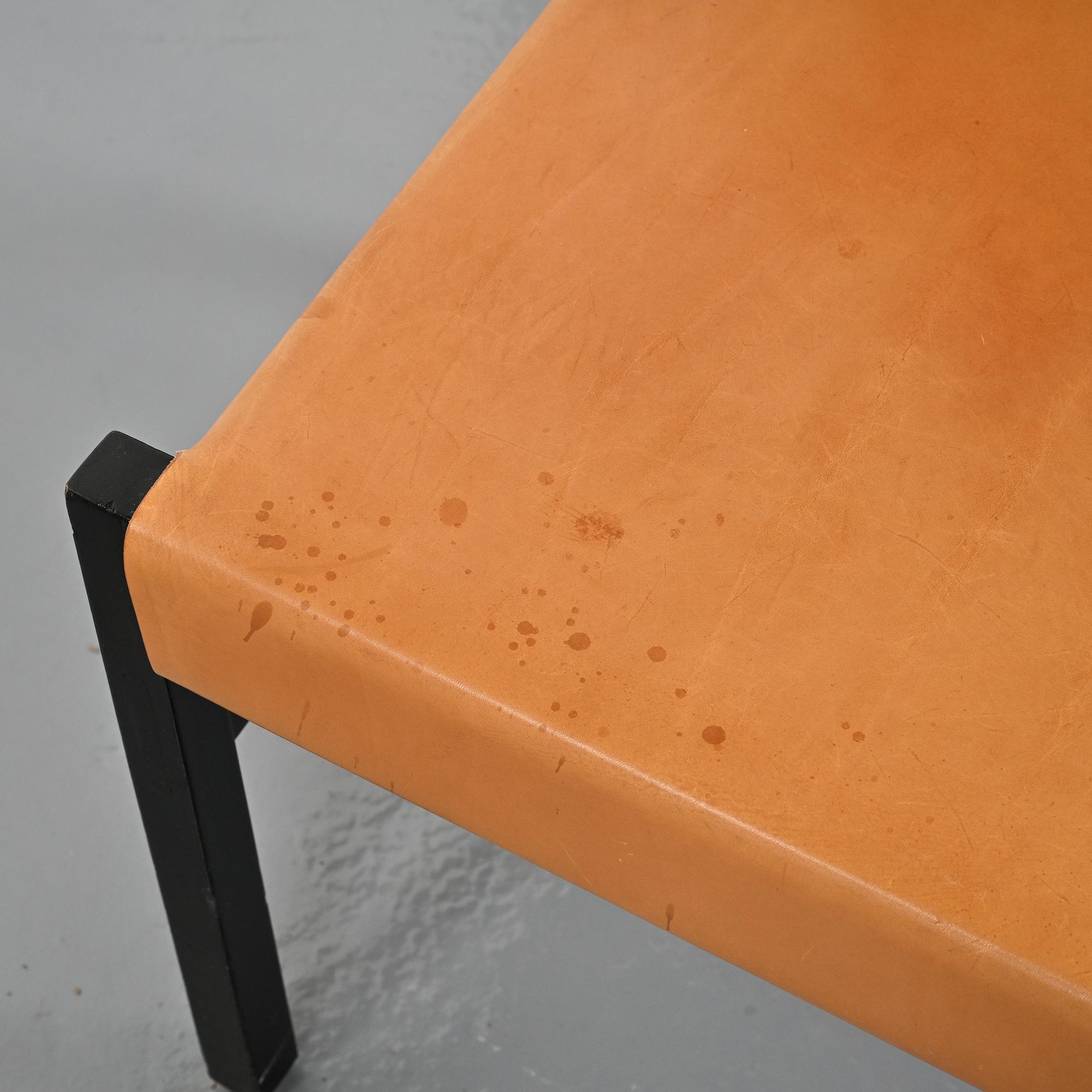 Set of black lacquered wooden chairs with leather, Swiss architect's work, 1980s.