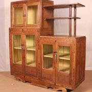 Antique Art Deco display cabinet in Burmese teak with original yellow patina interior.
