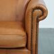 Fauteuil en cuir de vachette couleur cognac
