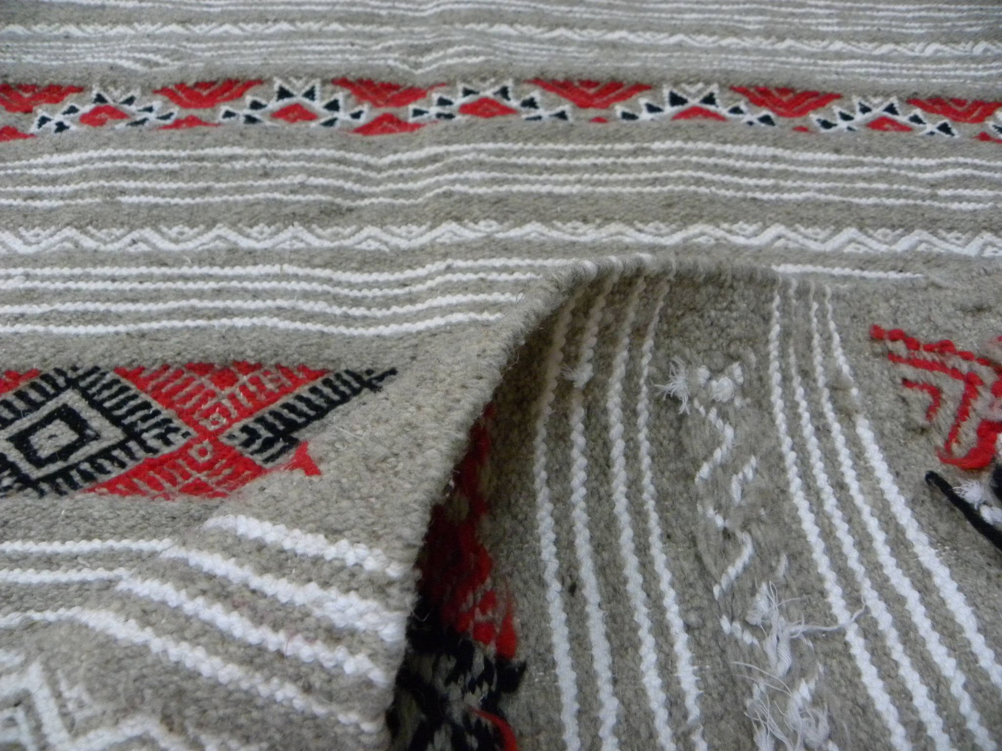 Geometric woven rug with fringes – Ethnic style – Hallway & interior