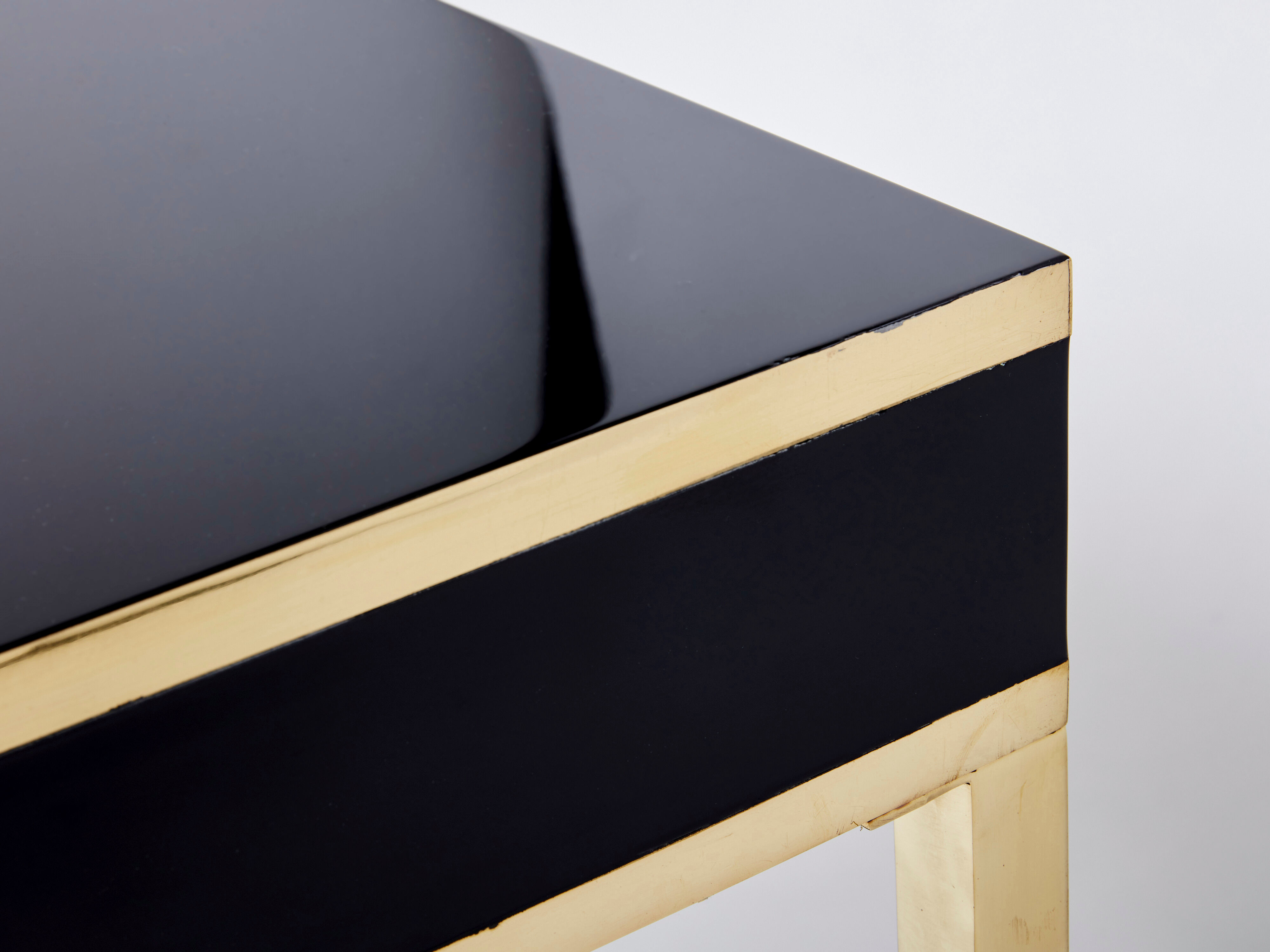 Pair of black lacquered consoles and brass 1970